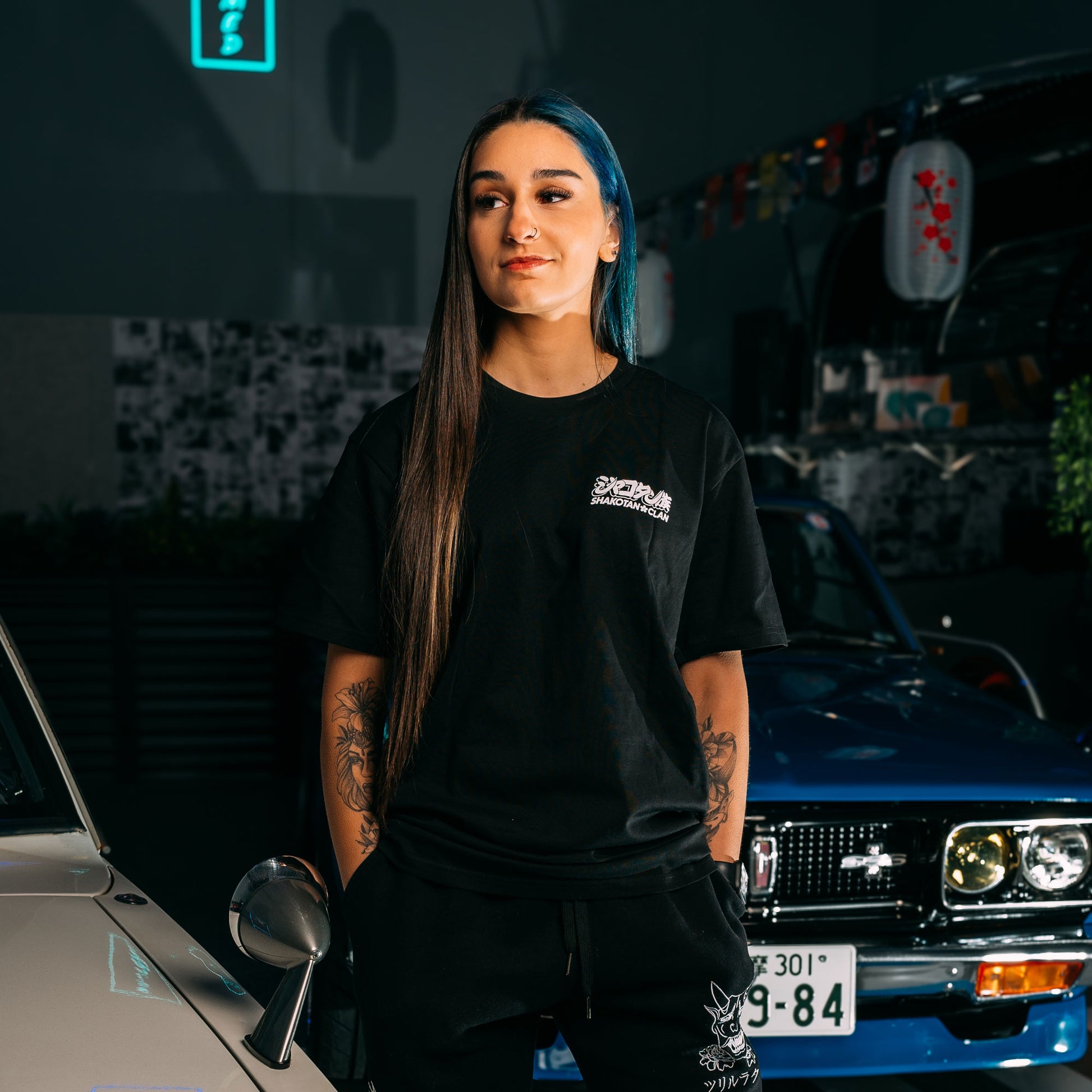 Model Wearing Advan A3A Black Classic T-Shirt Showing The Front Print
