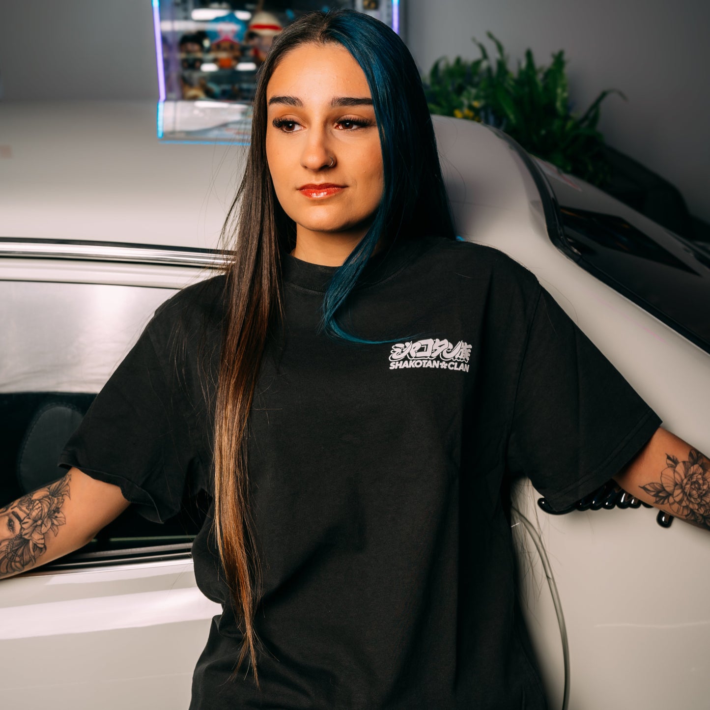 Model Wearing Gold_Starshark_Black_Heavy_Faded_T-Shirt_Showing The Front_Print