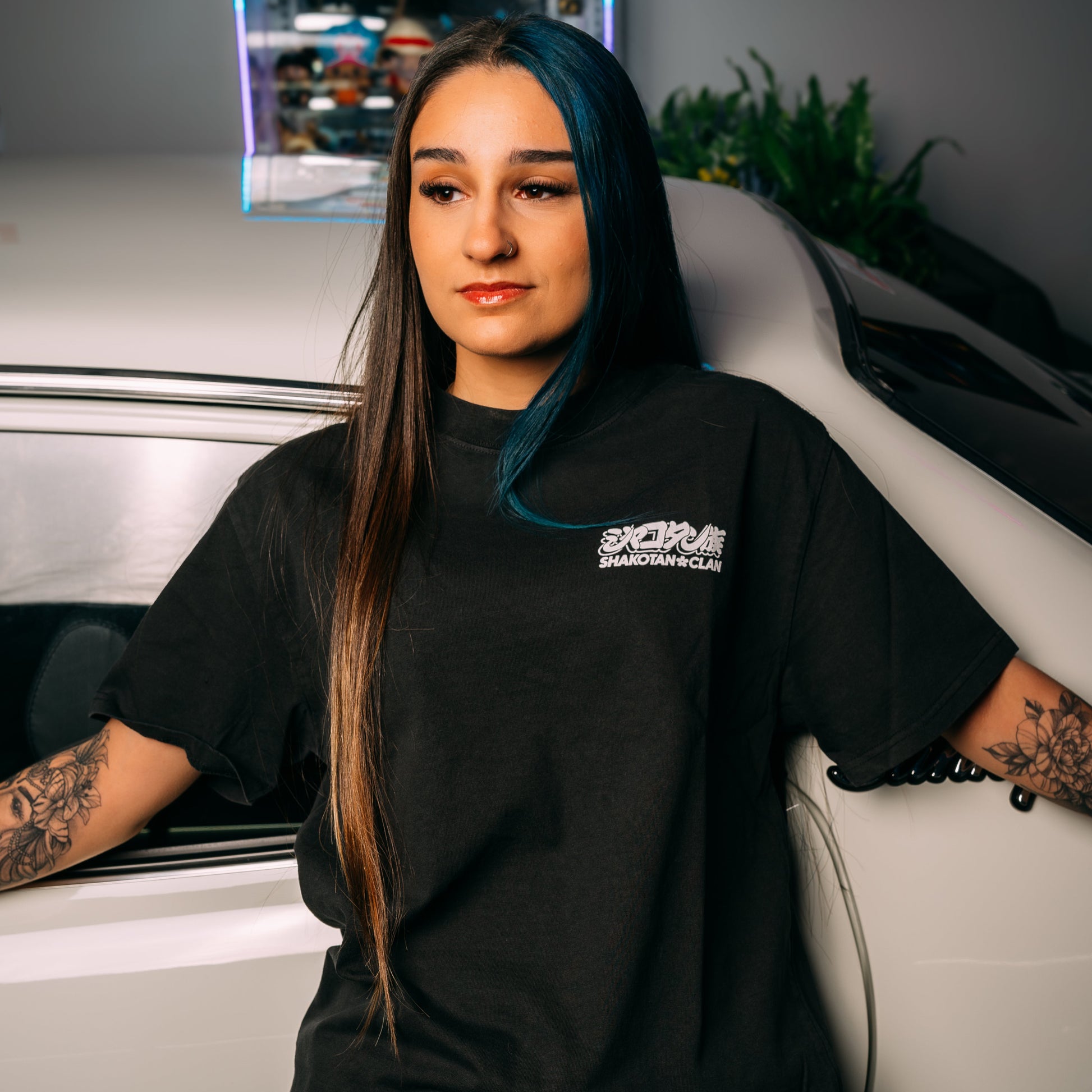 Model Wearing Gold_Starshark_Black_Heavy_Faded_T-Shirt_Showing The Front_Print