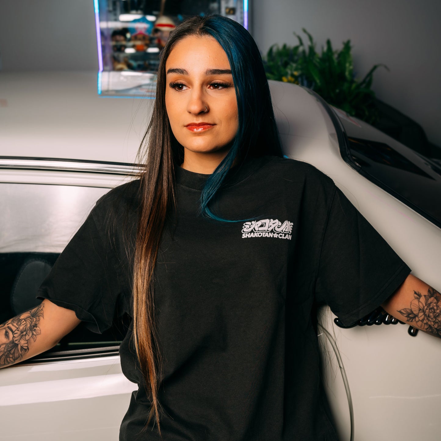Model Wearing Long Champ Black Heavy Faded T-Shirt Showing The Front Print