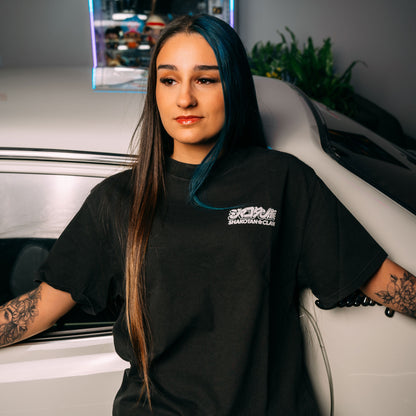 Model Wearing Long Champ Black Heavy Faded T-Shirt Showing The Front Print