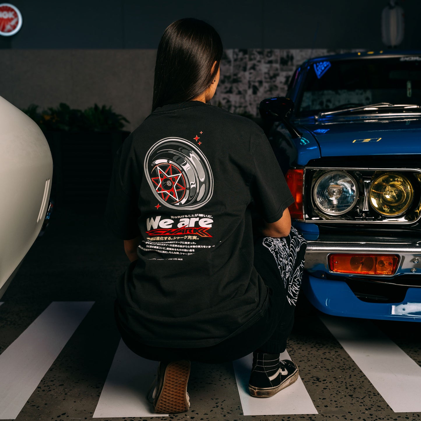 Model Wearing Red_Starshark_Black_Heavy_Faded_T-Shirt_Showing The Back_Print