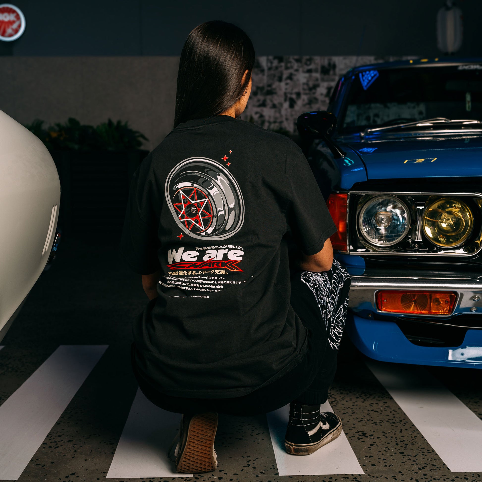 Model Wearing Red_Starshark_Black_Heavy_Faded_T-Shirt_Showing The Back_Print